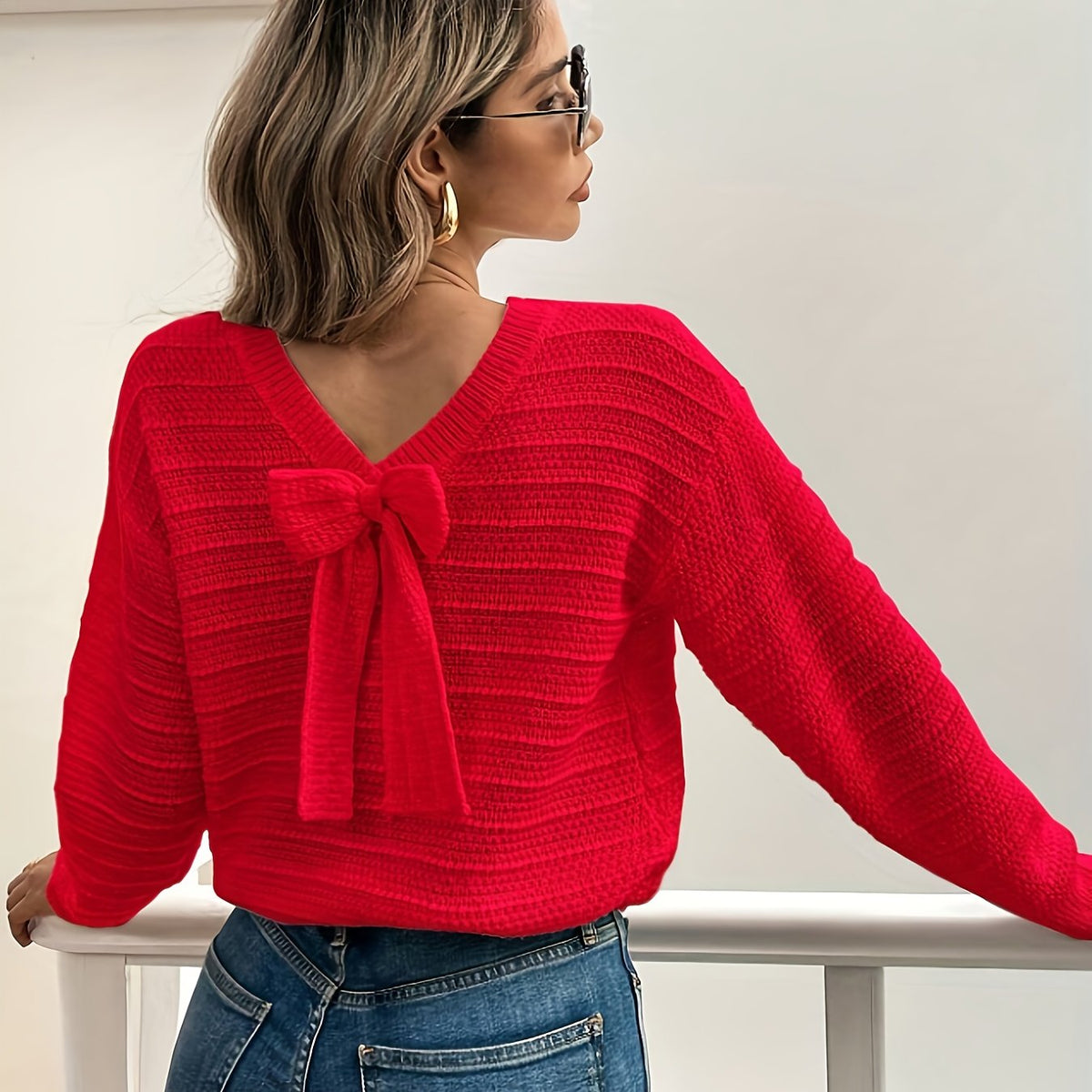 Pull en maille texturée à nœud et col V pour femme