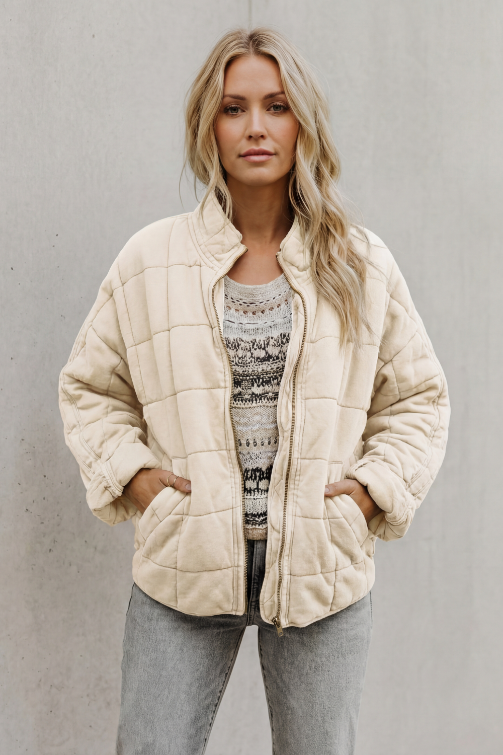 Veste matelassée molletonnée à col haut et zip pour femme