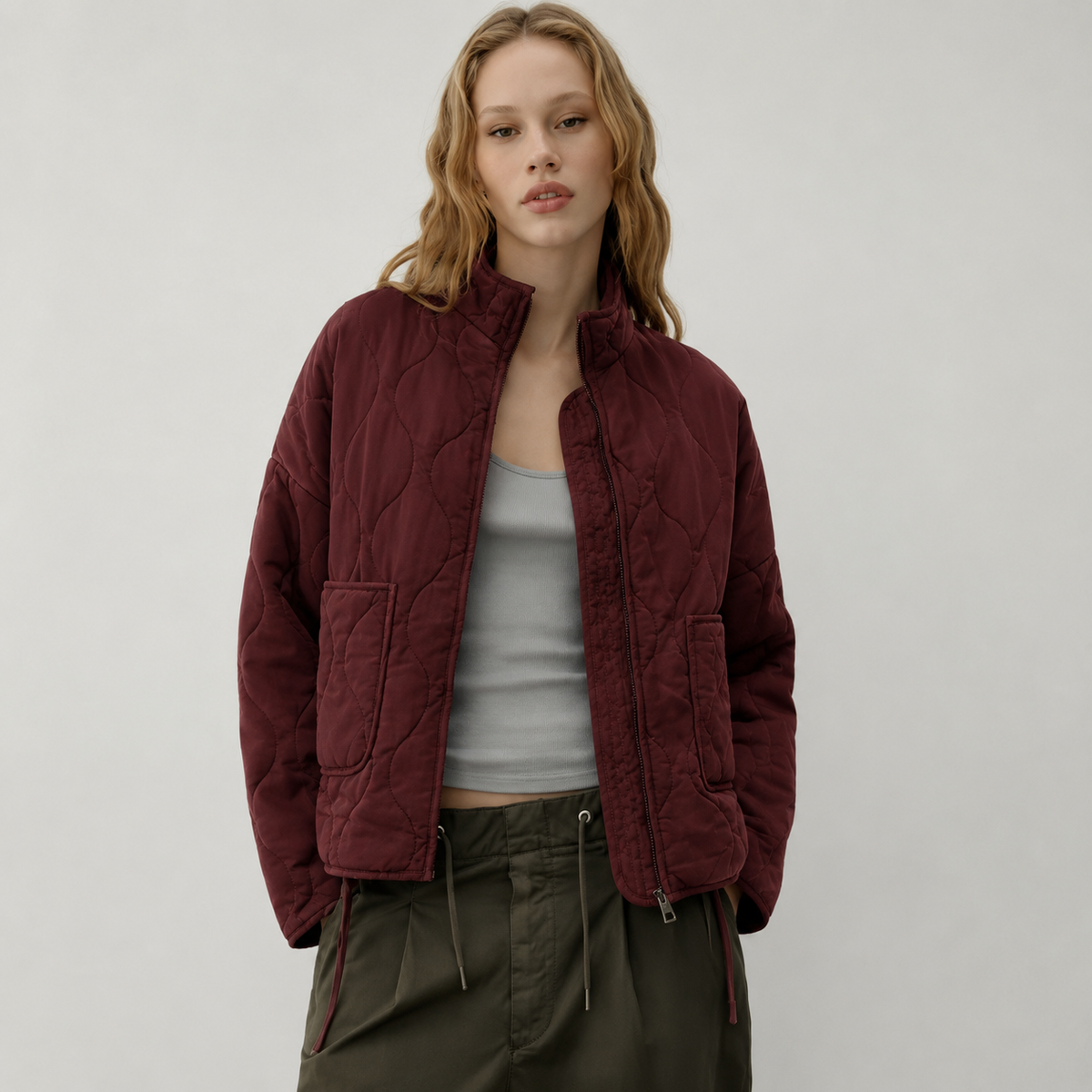 Veste matelassée à col montant et poches plaquées pour femme
