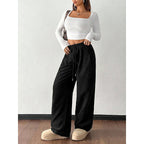 Pantalon ample à taille élastique avec cordon et poches pour femme