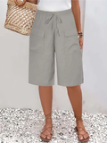 Short taille élastique à poches pour femme