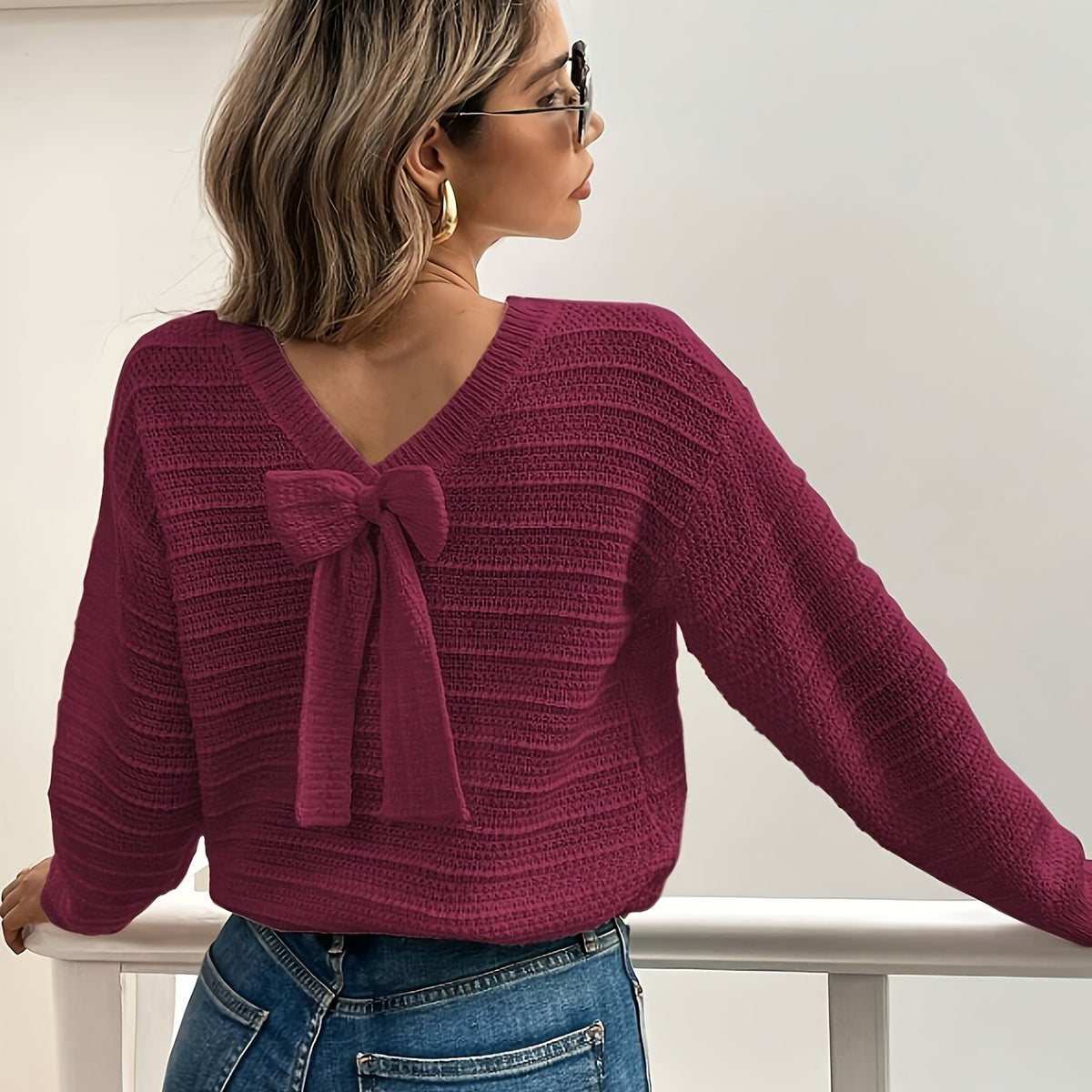 Pull en maille texturée à nœud et col V pour femme