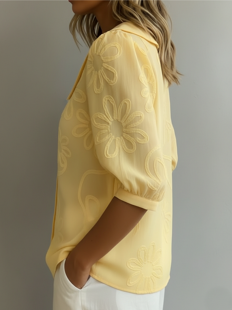 Women's blouse with embroidered floral pattern