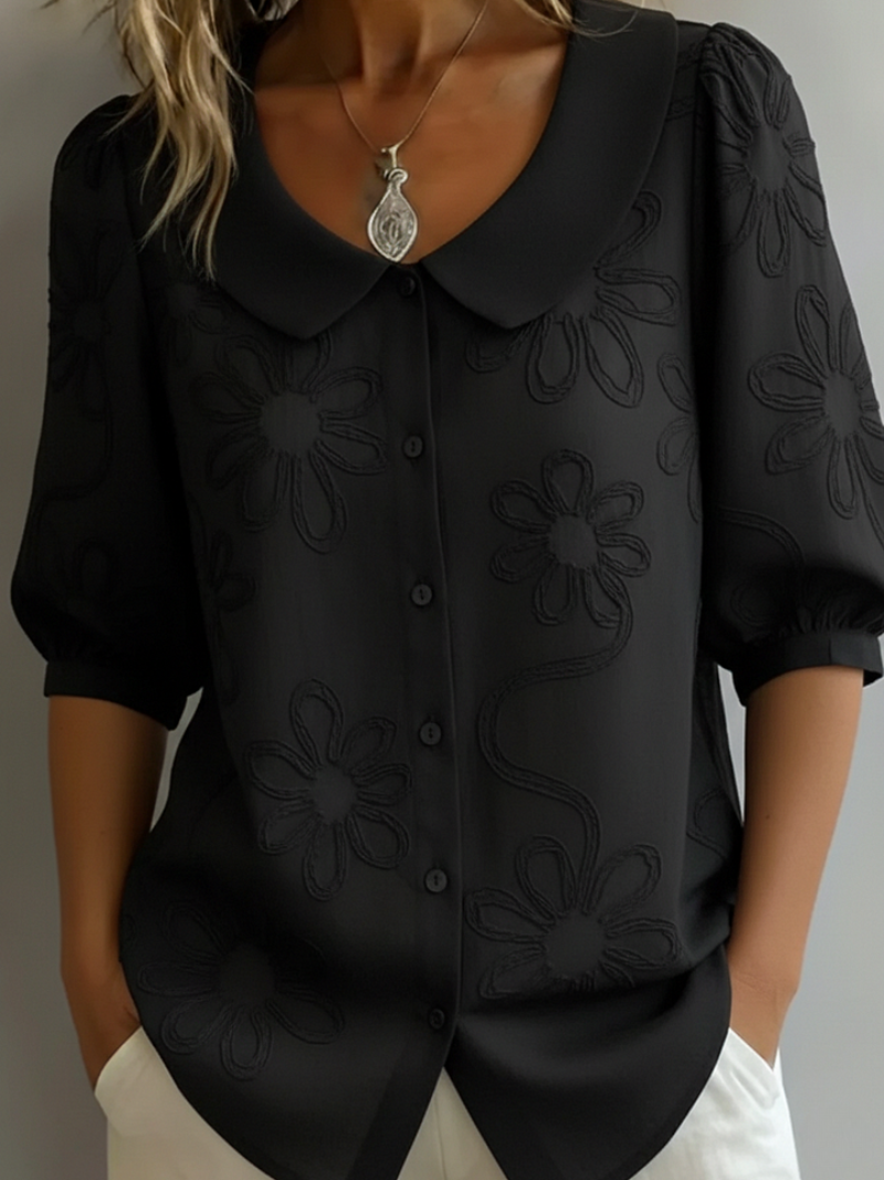 Women's blouse with embroidered floral pattern