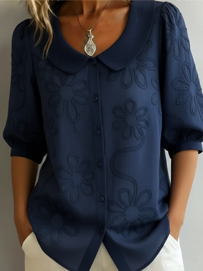 Women's blouse with embroidered floral pattern