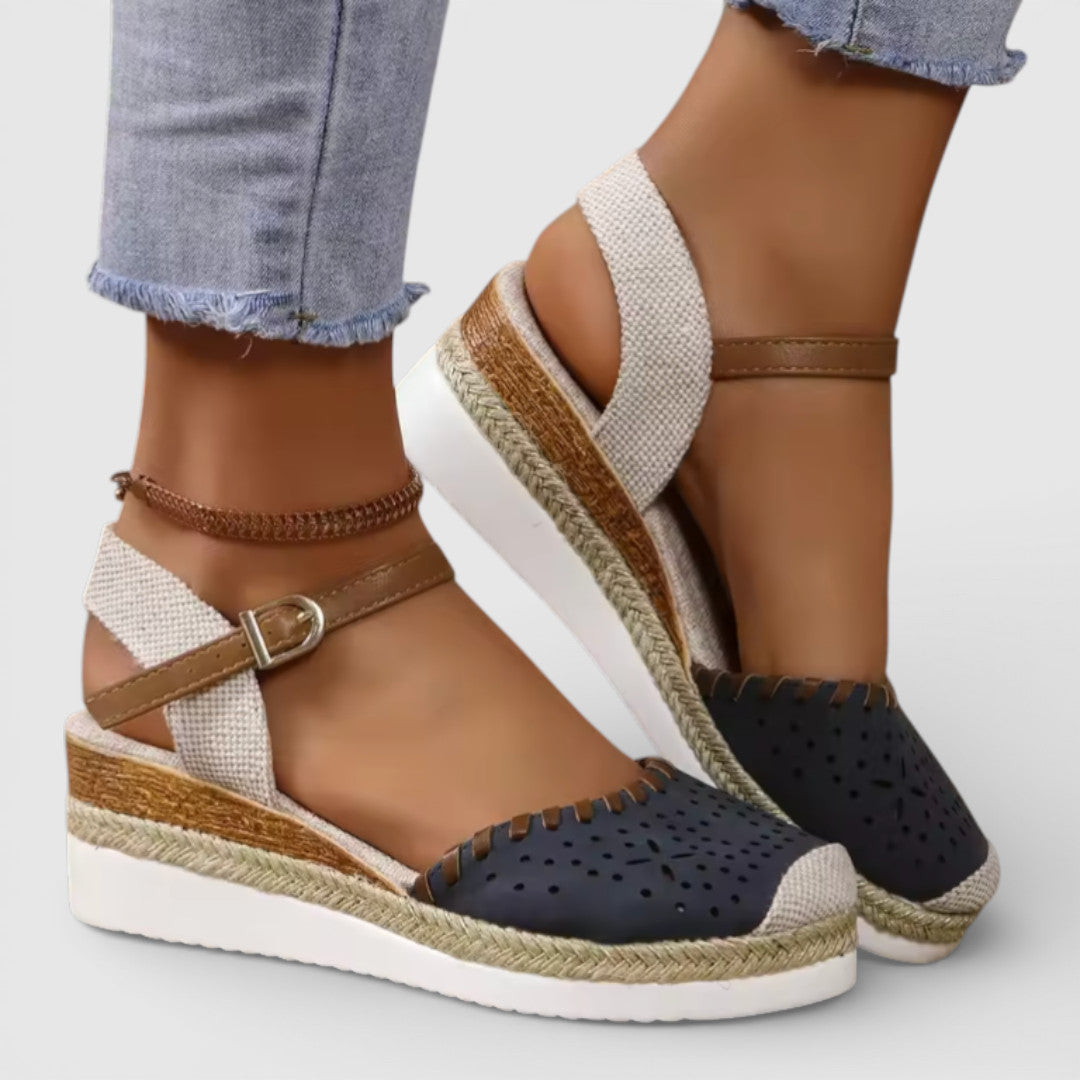 Women's closed-toe wedge espadrille sandals with perforated upper and braided sole