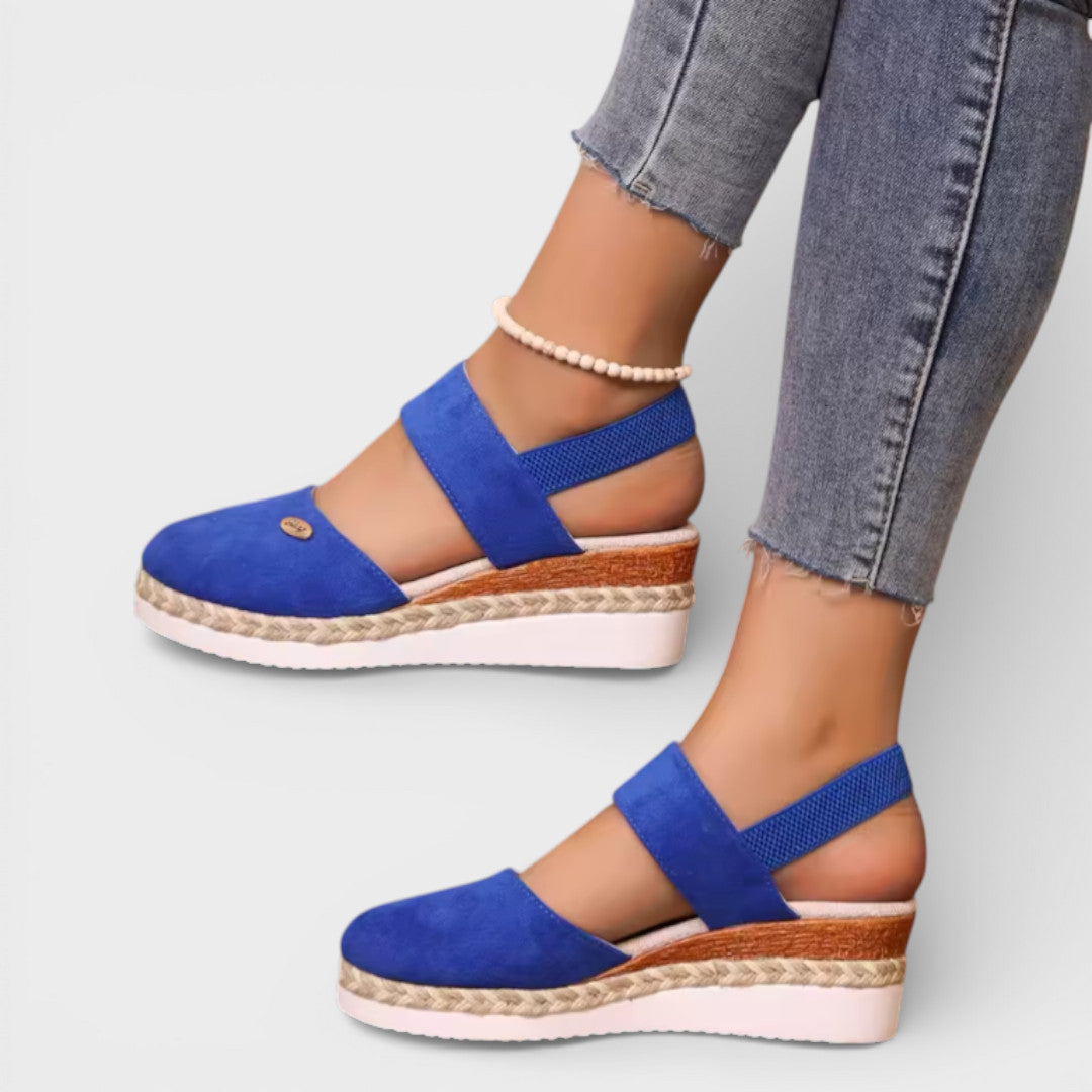 Women's closed-toe wedge sandals with ankle strap
