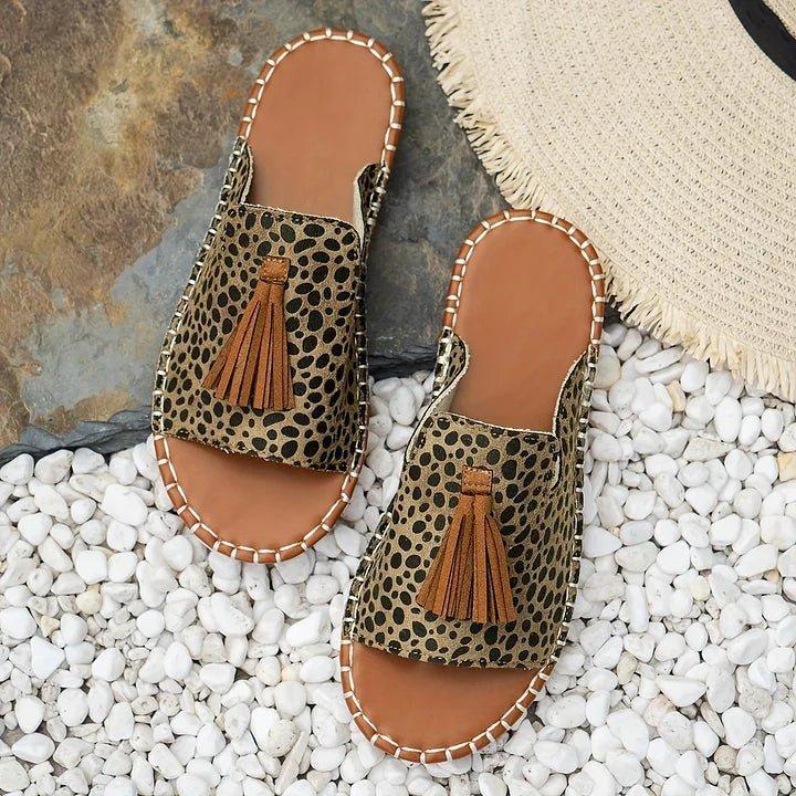 Women's flat slide sandals with open toe and tassel detail