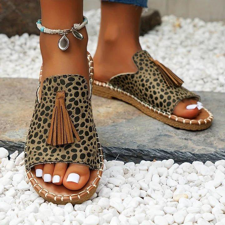 Women's flat slide sandals with open toe and tassel detail