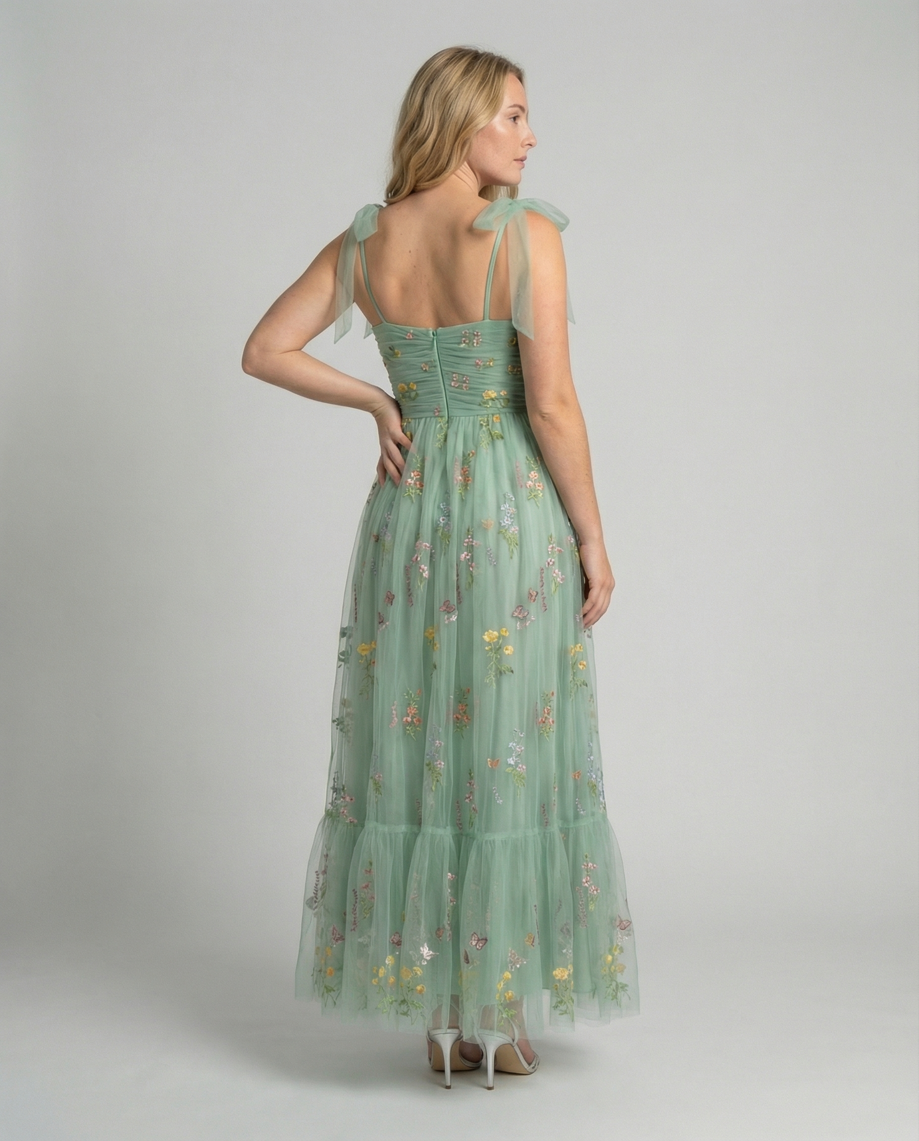 Women's floor-length ball gown with tulle skirt and structured bodice