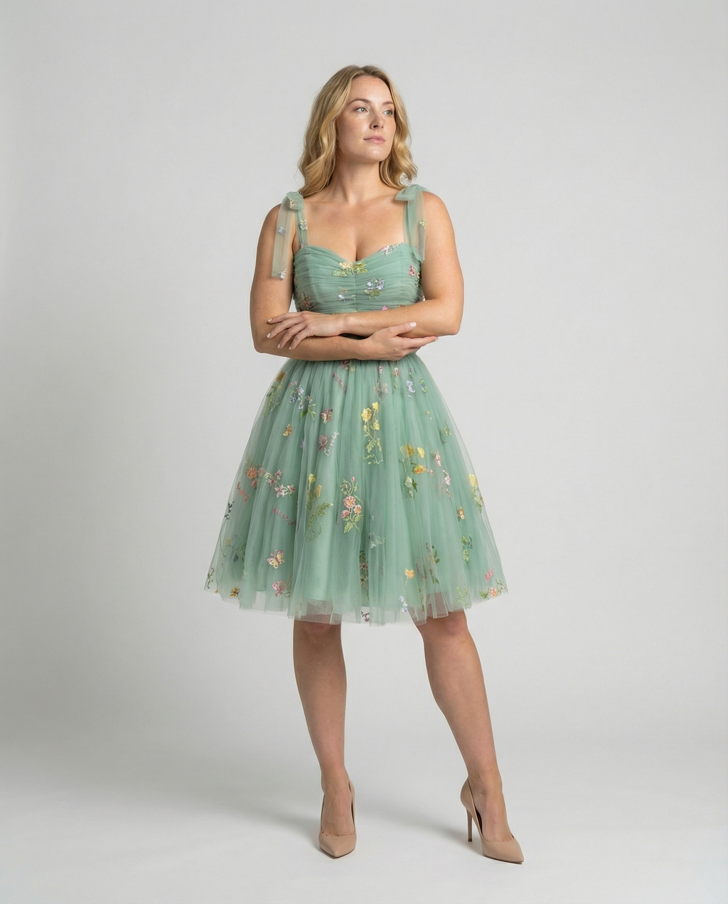Women's floor-length ball gown with tulle skirt and structured bodice