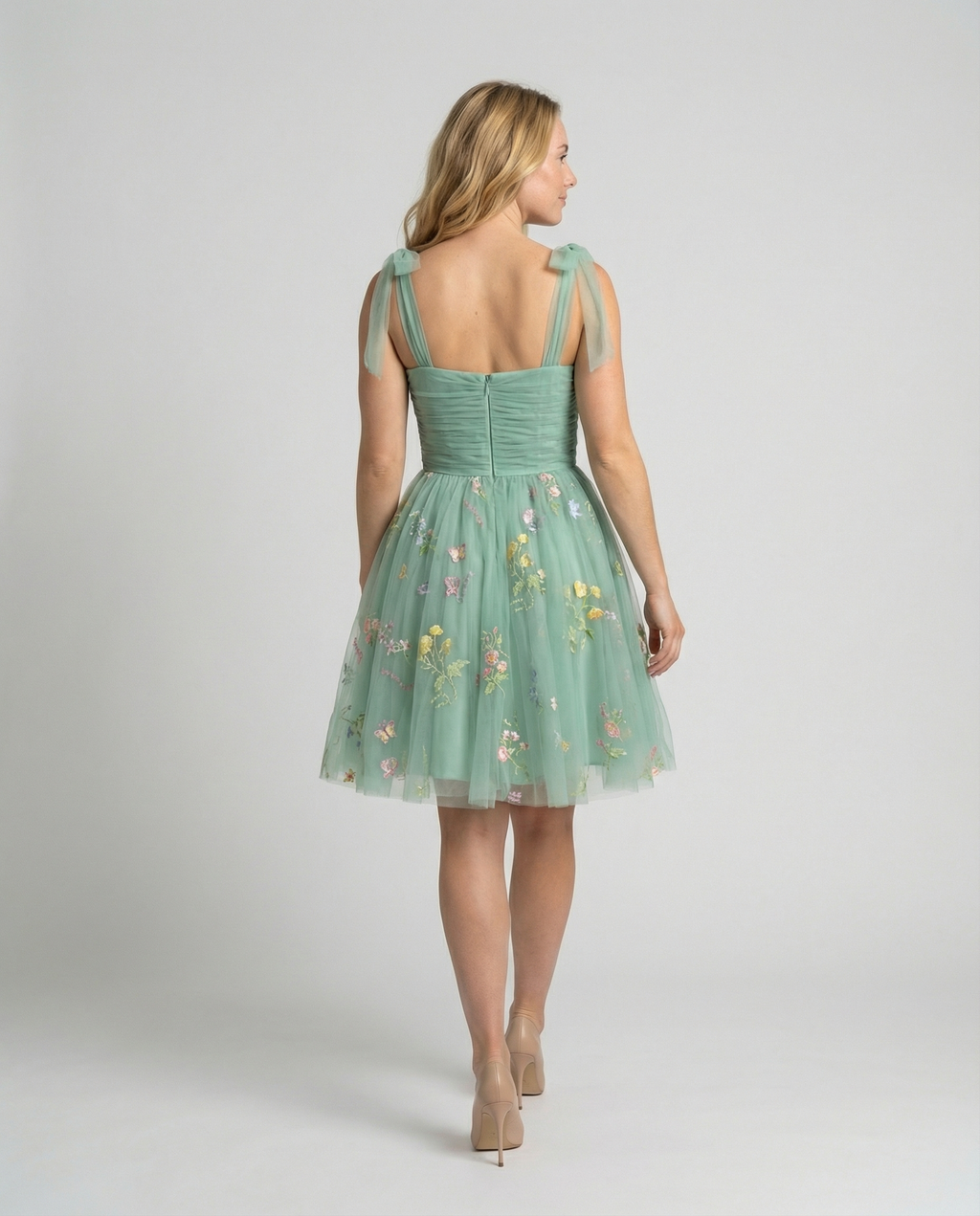 Women's floor-length ball gown with tulle skirt and structured bodice