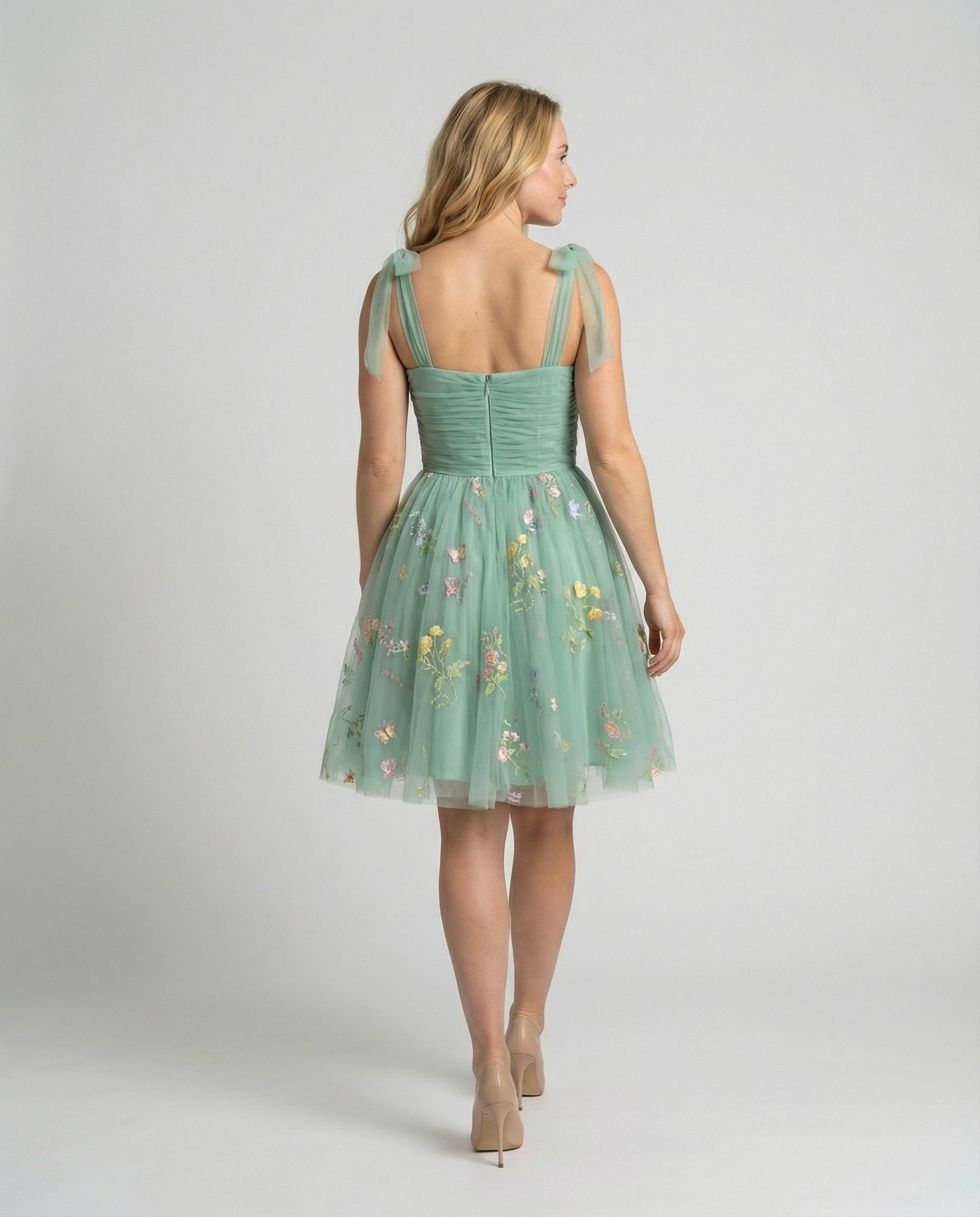 Women's floor-length ball gown with tulle skirt and structured bodice