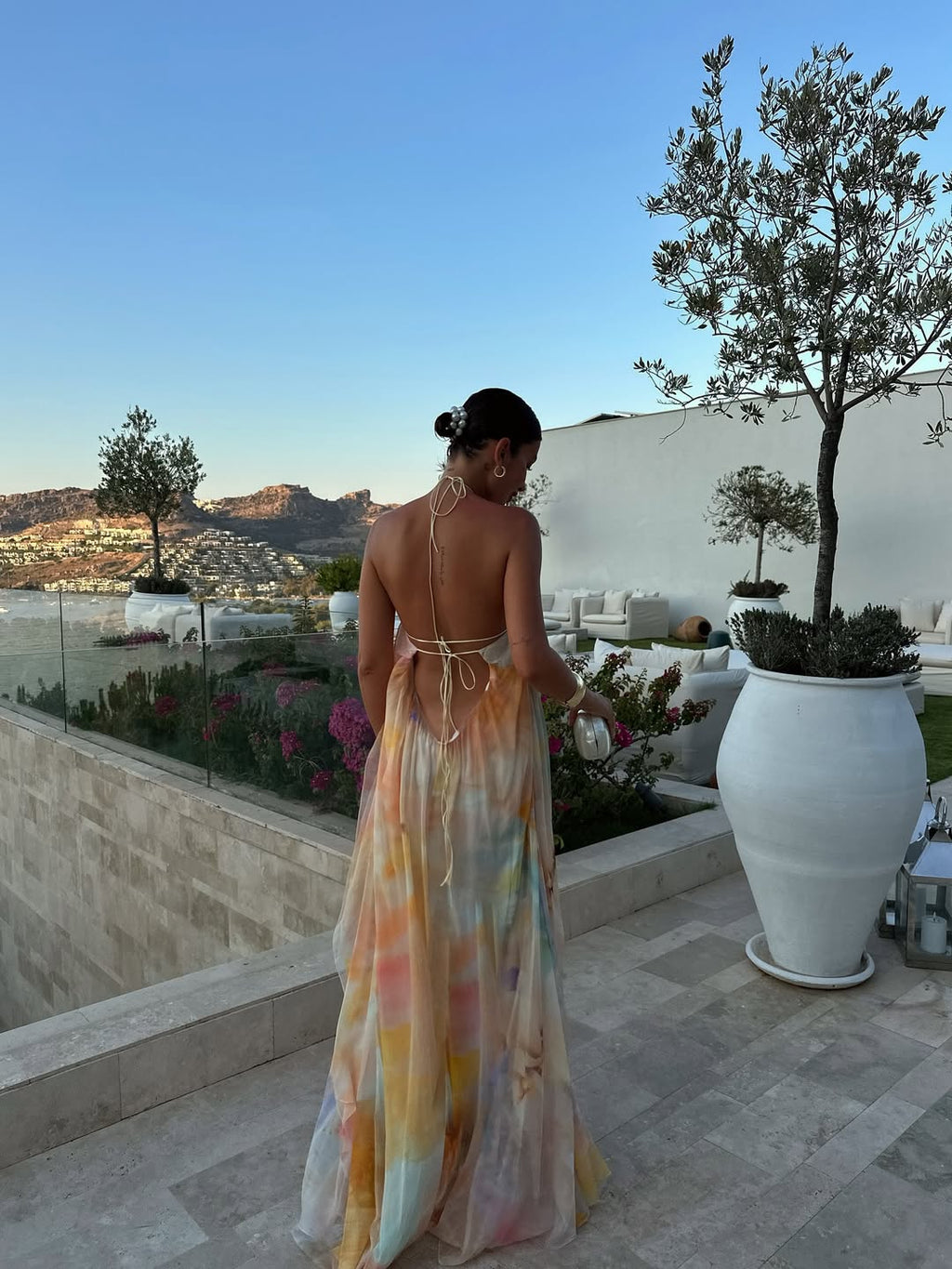 Women's halter-neck maxi dress with floral print and flowy skirt