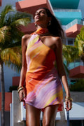 Women's halter neck mini dress with flowing skirt