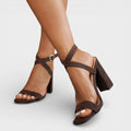 Women's heeled sandals with crossed straps and ankle fastening
