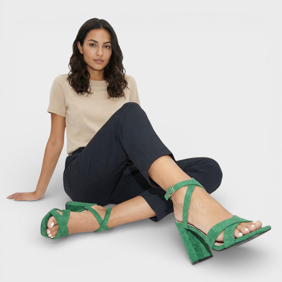 Women's heeled sandals with crossed straps and ankle fastening