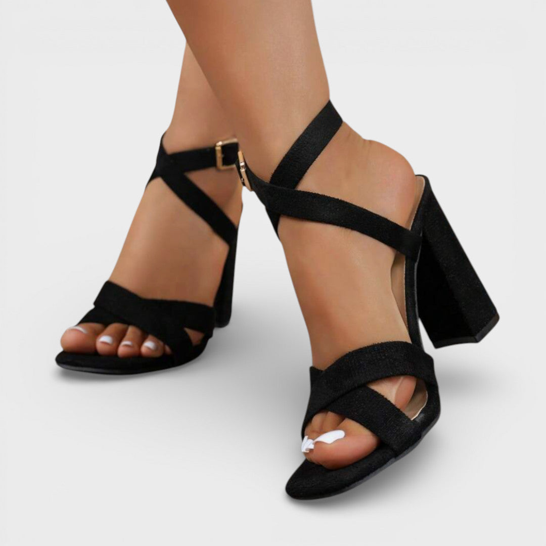 Women's heeled sandals with crossed straps and ankle fastening