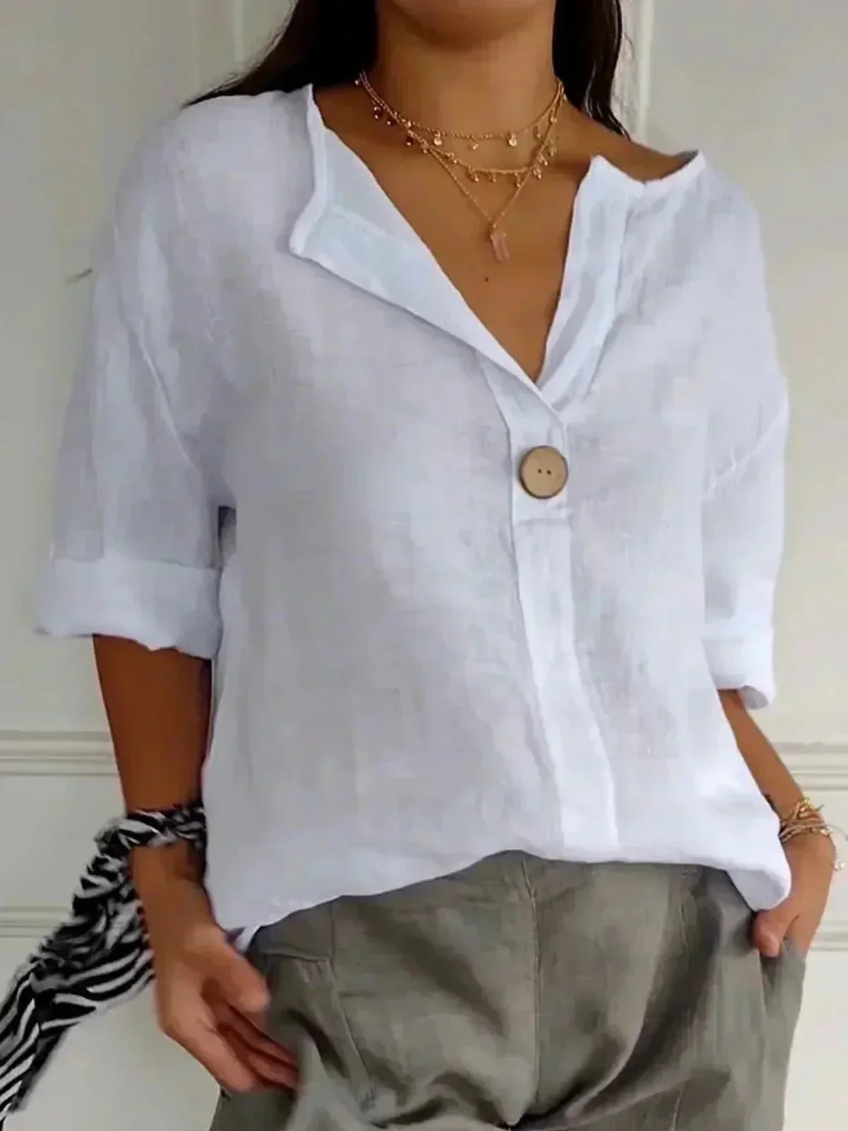 Women's oversized blouse with button fastening