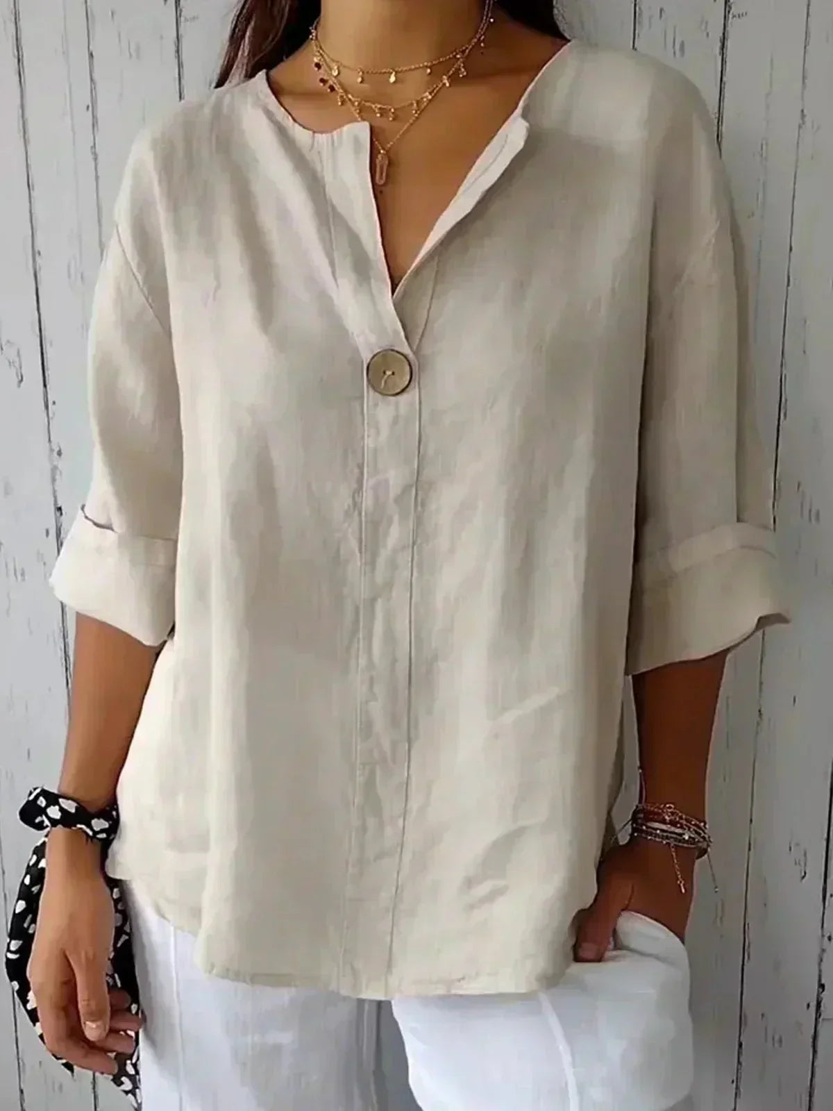 Women's oversized blouse with button fastening