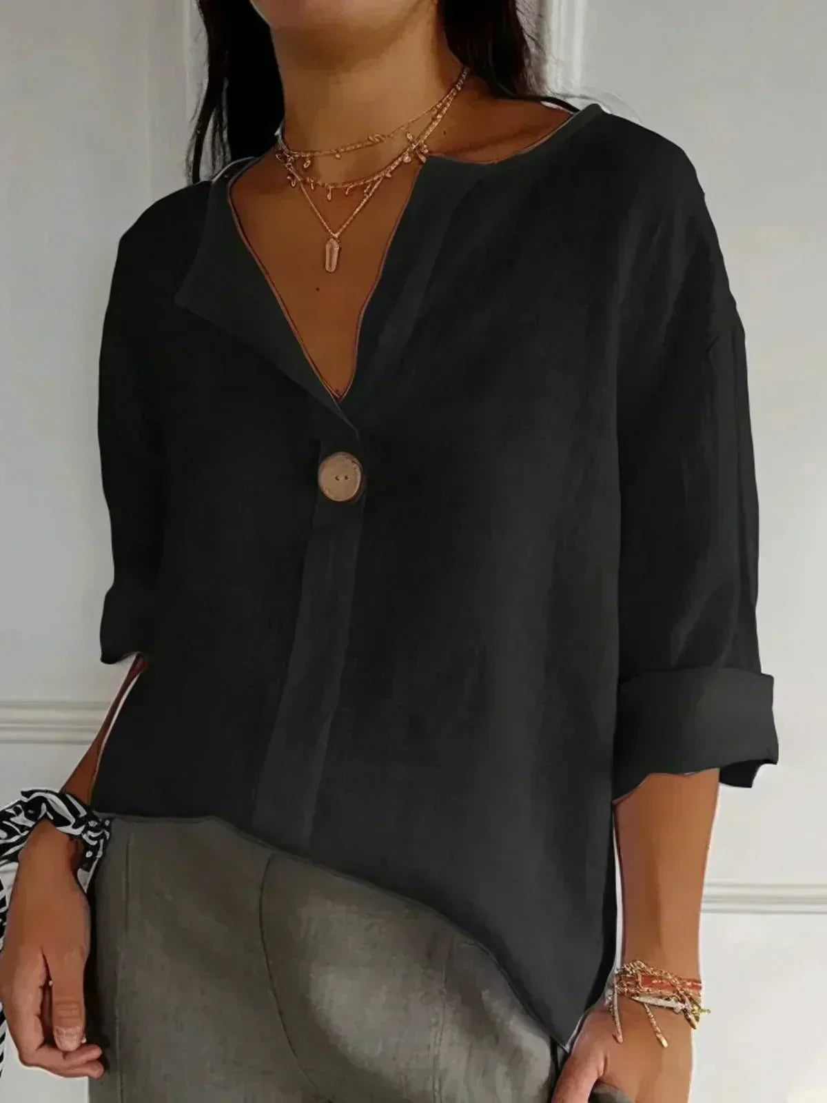 Women's oversized blouse with button fastening