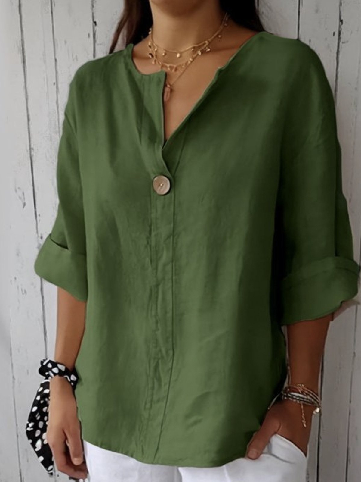 Women's oversized blouse with button fastening