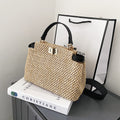Women's portable shoulder bag with woven straw construction