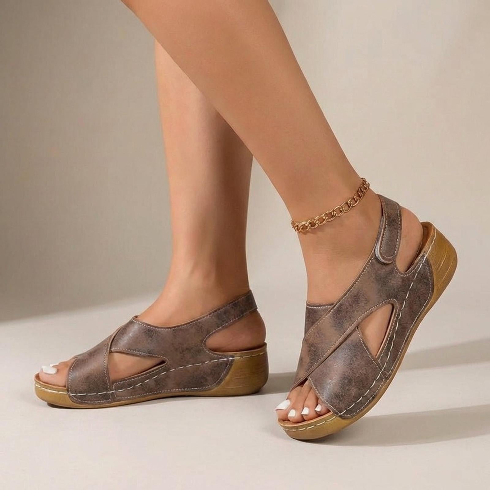 Women's wedge sandals with criss-cross straps and slingback