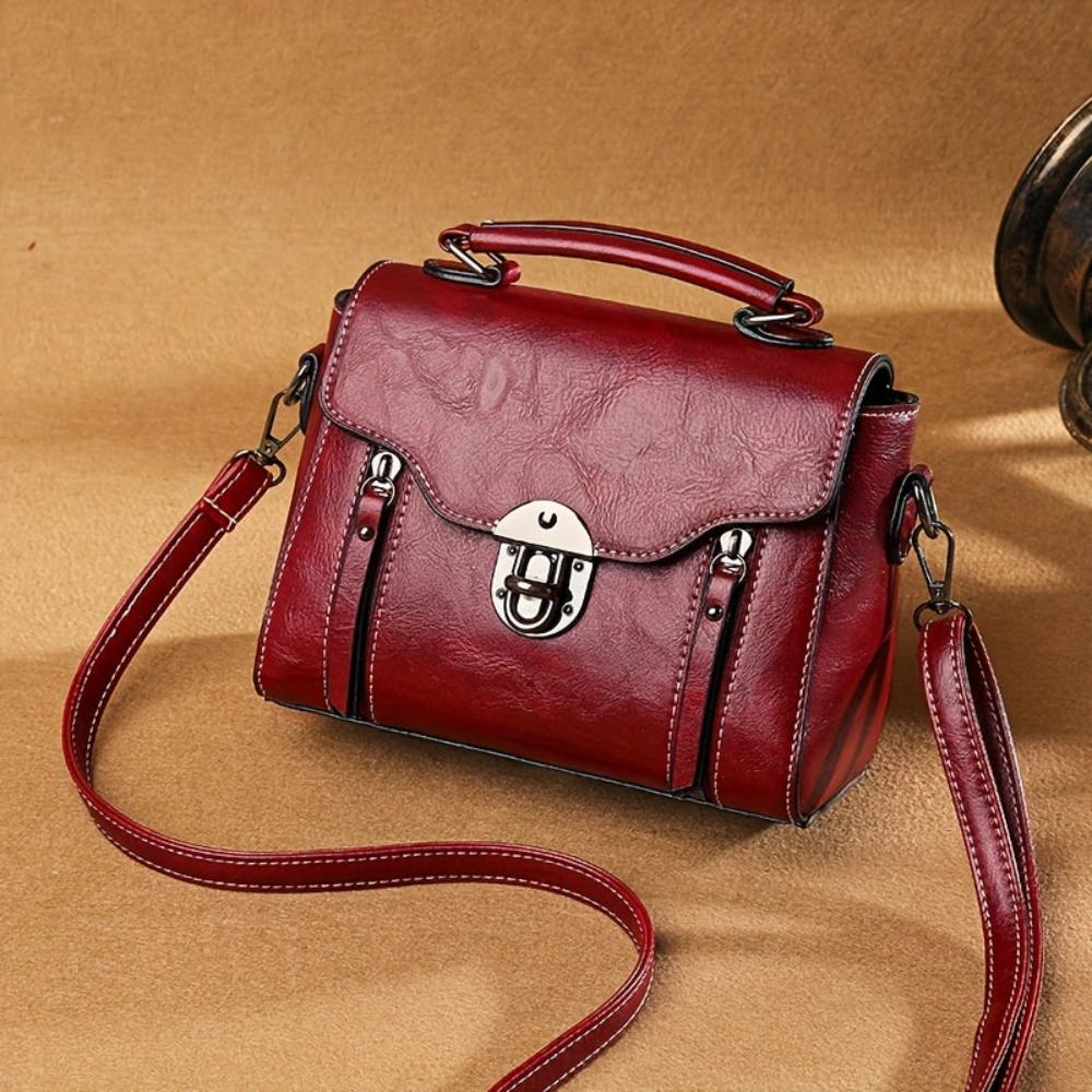 Sac bandoulière femme à rabat, poignée supérieure et fermeture à boucle